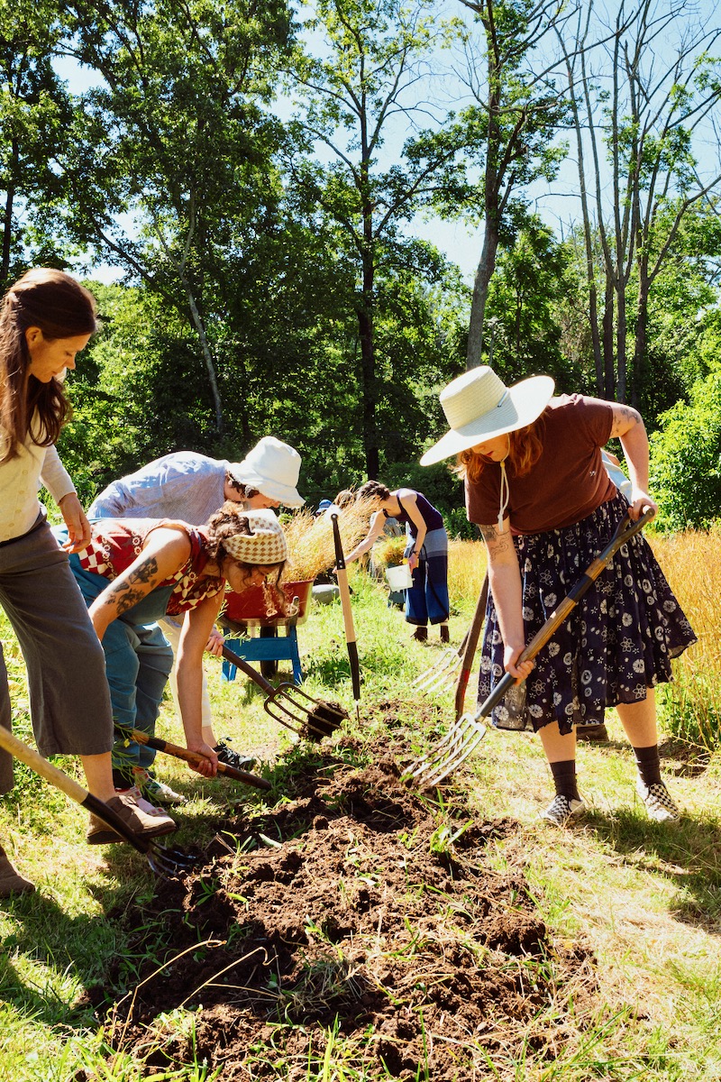 Teacher training students gardening